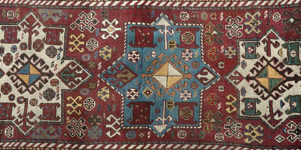 Antique tribal Caucasian Kazak rug