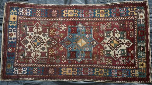 Antique tribal Caucasian Kazak rug